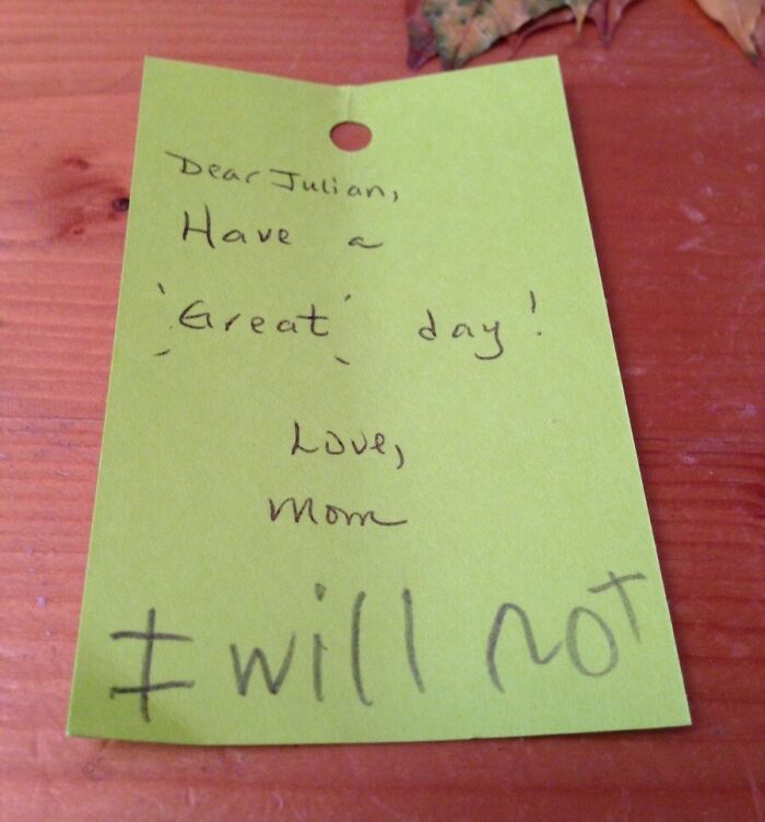 Handwritten note showing suspiciously unbothered reply to a loving message on a green paper.