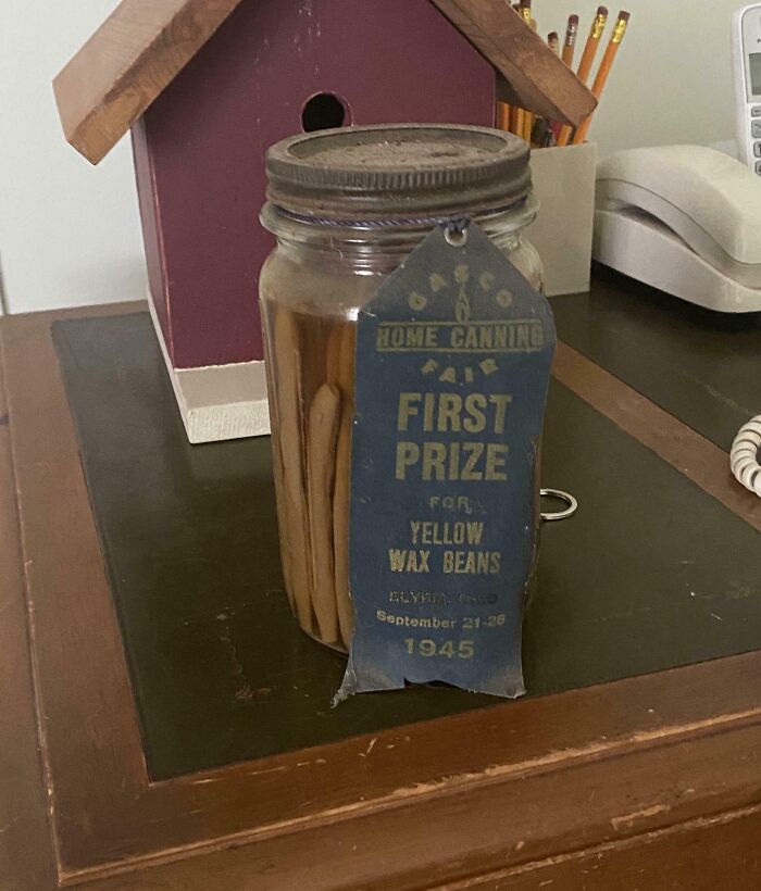 Vintage jar with yellow wax beans and a 1945 first prize ribbon found in an old home under the floor boards.