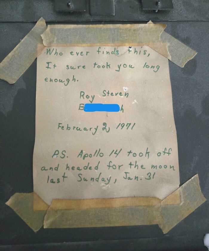 Handwritten note taped under floorboards mentioning Apollo 14 and dated February 2, 1971 in an old home discovery.