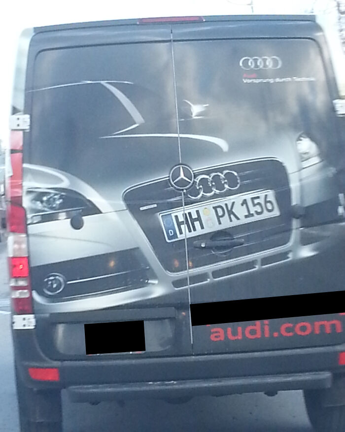 Van advertising fail showing a car image with conflicting Mercedes and Audi branding logos.