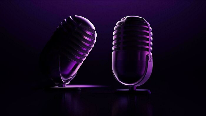 Two vintage microphones with purple lighting, showcasing innovative design making the world smarter and cooler.