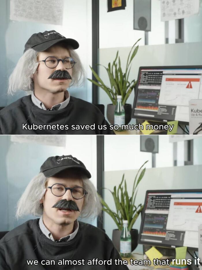 Person dressed as a programmer with fake mustache and glasses in front of a computer, programming and computer science meme.