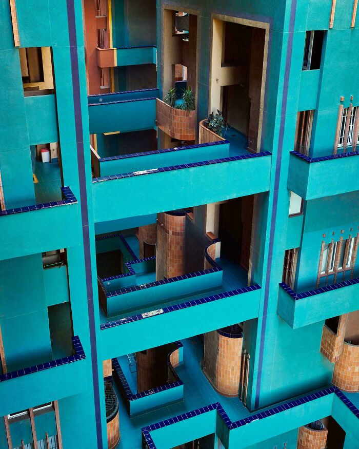 Colorful modern architectural feat with turquoise walls and geometric design showcasing impressive structural elements.