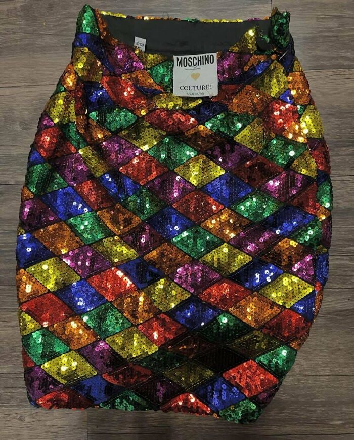 Colorful sequin skirt found at thrift store with vibrant diamond pattern and Moschino Couture label on wooden floor background