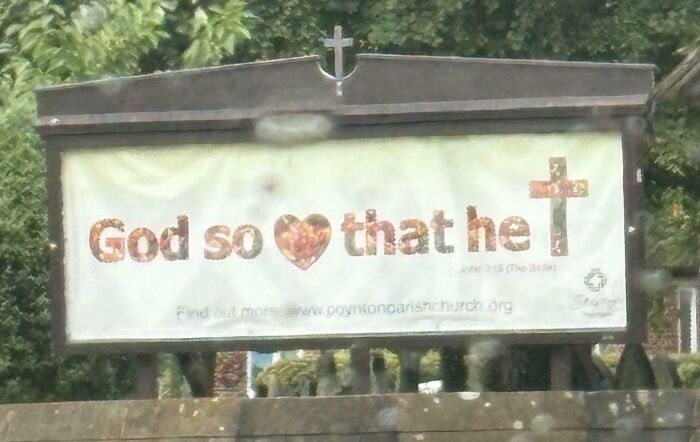 Billboard with a religious message featuring a heart and cross, illustrating another unattainable body portrayal in advertising fails.