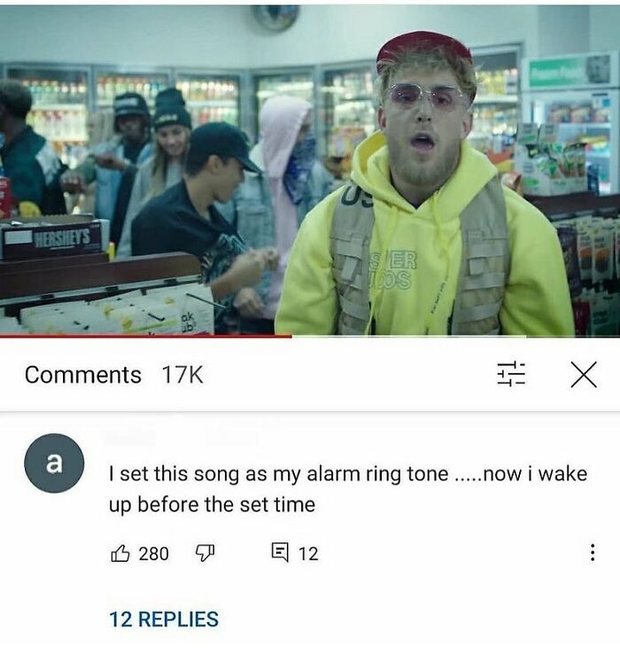 Young man in a store with a yellow hoodie and sunglasses, related to weird and unhinged humor memes online.