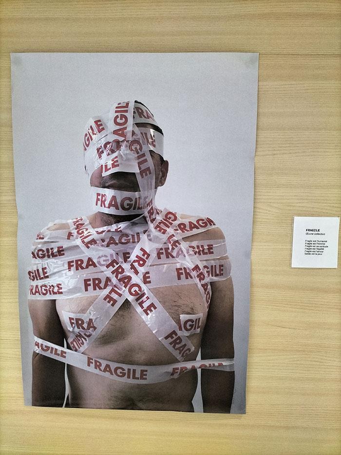 Man wrapped in fragile tape representing domestic violence and injury in a landmark case against ex-girlfriend. Man wrapped in fragile tape representing domestic violence and injury in a landmark case against ex-girlfriend.