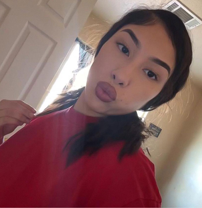 Young woman posing indoors, demonstrating lip filler results, related to after baby lost his life in car incident case