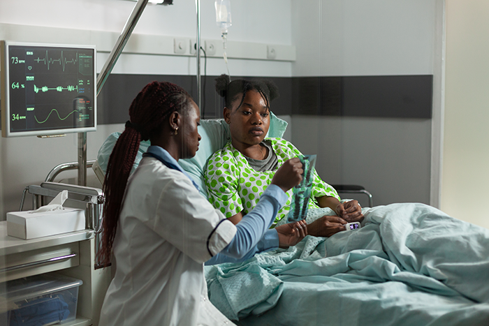 Woman accused of cheating due to daughter’s dark skin listens to doctor in hospital room during DNA test discussion. Woman accused of cheating due to daughter’s dark skin listens to doctor in hospital room during DNA test discussion.