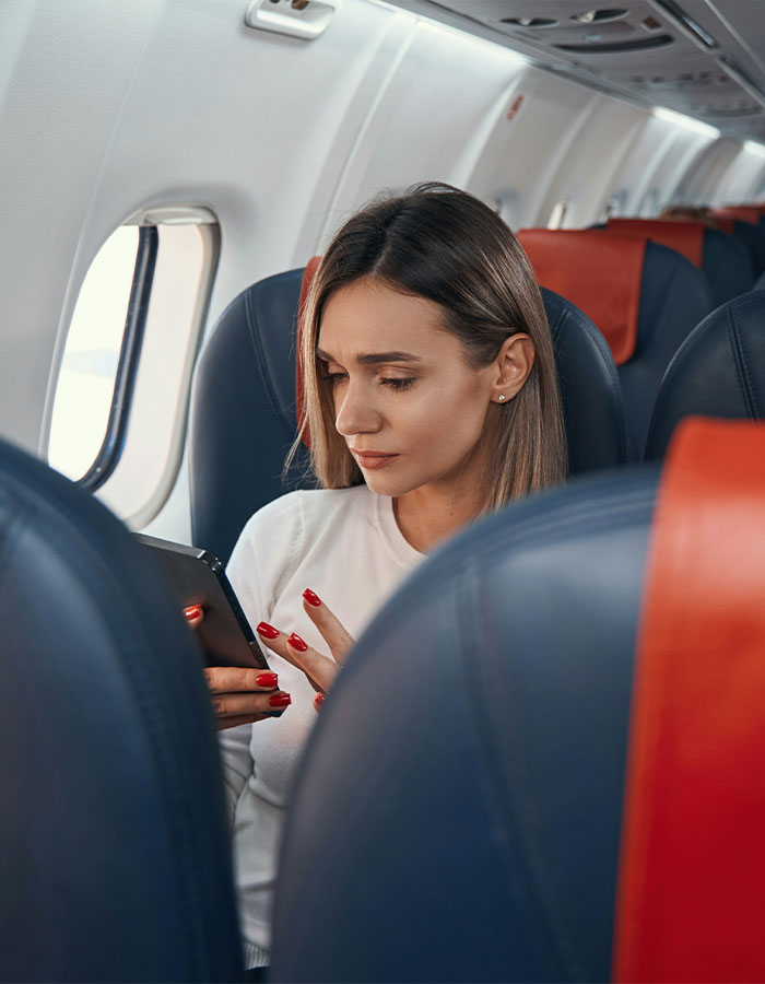 Passenger sitting on flight looking at phone, sparking scare and causing emergency landing after reading seat neighbor's text. Passenger sitting on flight looking at phone, sparking scare and causing emergency landing after reading seat neighbor's text.