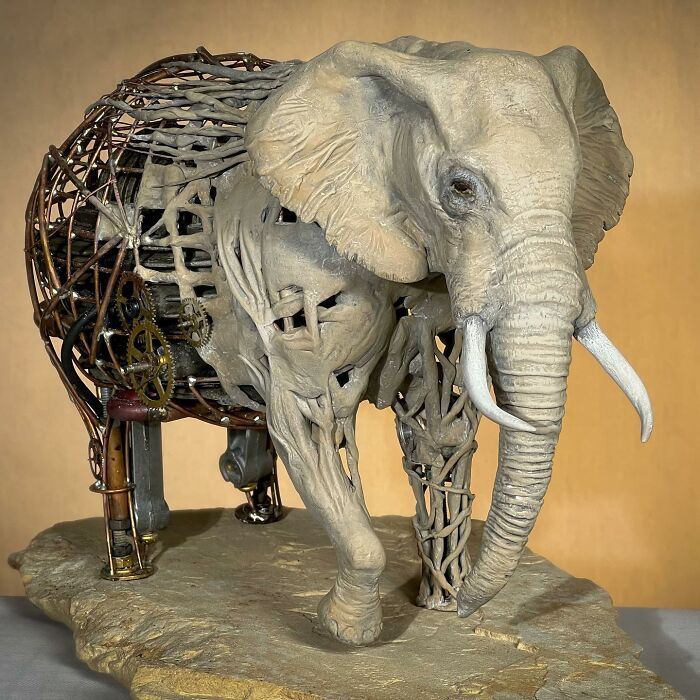 Elephant scrap metal animal sculpture with detailed mechanical and textured elements, showcasing striking artistic craftsmanship.