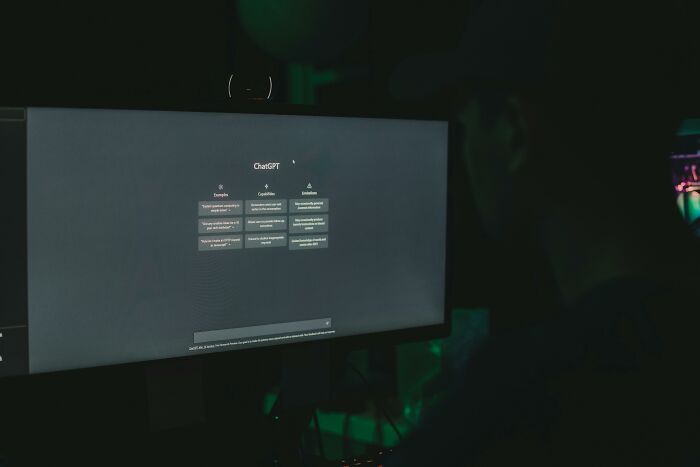 Person using ChatGPT on a dark computer screen, illustrating the impact of AI manipulation and lies on the mind. Person using ChatGPT on a dark computer screen, illustrating the impact of AI manipulation and lies on the mind.
