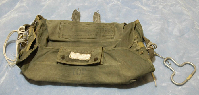 Old military-style parachute bag laid flat on a surface, related to newly released DB Cooper FBI documents. Old military-style parachute bag laid flat on a surface, related to newly released DB Cooper FBI documents.