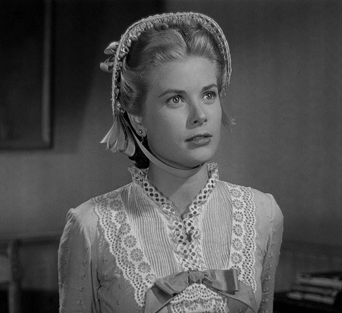 Black and white portrait of a woman in vintage lace dress and bonnet, evoking Grace Kelly’s granddaughter legendary look revival. Black and white portrait of a woman in vintage lace dress and bonnet, evoking Grace Kelly’s granddaughter legendary look revival.