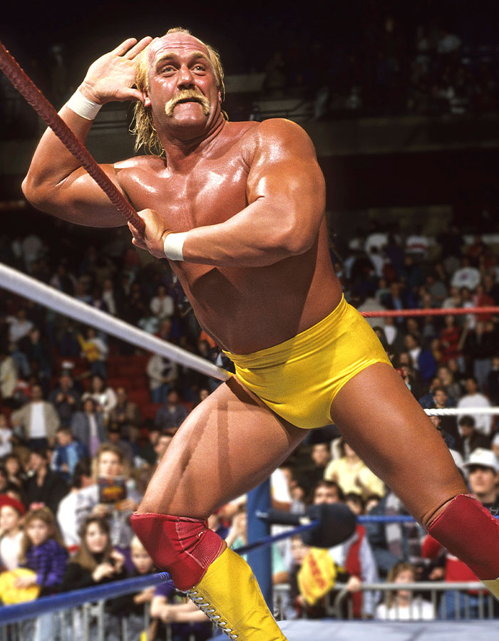 WWE legend Hulk Hogan in yellow trunks posing in the ring with fans watching, related to his cause of passing at 71. WWE legend Hulk Hogan in yellow trunks posing in the ring with fans watching, related to his cause of passing at 71.