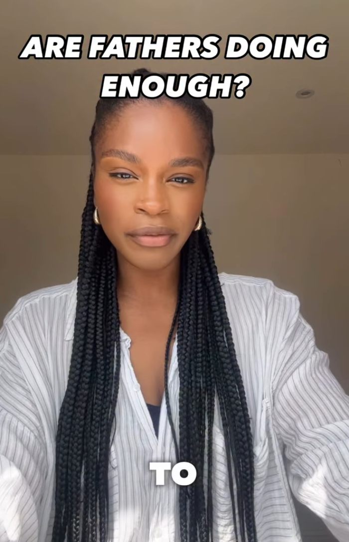 Woman with long braids wearing a striped shirt, discussing the 2YO toddler realizing she’s Black after daycare experience. Woman with long braids wearing a striped shirt, discussing the 2YO toddler realizing she’s Black after daycare experience.