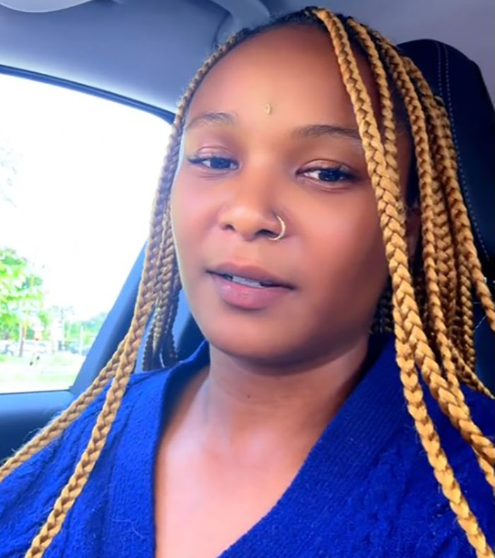 A woman with braided hair and a nose ring inside a car, related to official sparks outrage flood-stricken camp Mystic controversy. A woman with braided hair and a nose ring inside a car, related to official sparks outrage flood-stricken camp Mystic controversy.