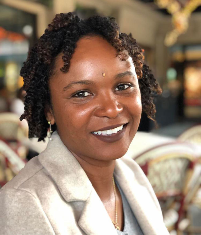 Portrait of a woman smiling indoors, related to official sparks outrage over flood-stricken Camp Mystic whites-only claim. Portrait of a woman smiling indoors, related to official sparks outrage over flood-stricken Camp Mystic whites-only claim.