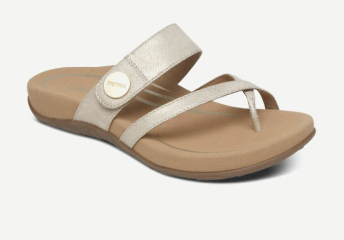 Beige comfortable sandal with a cushioned sole and stylish straps, perfect for sandal season in Europe.