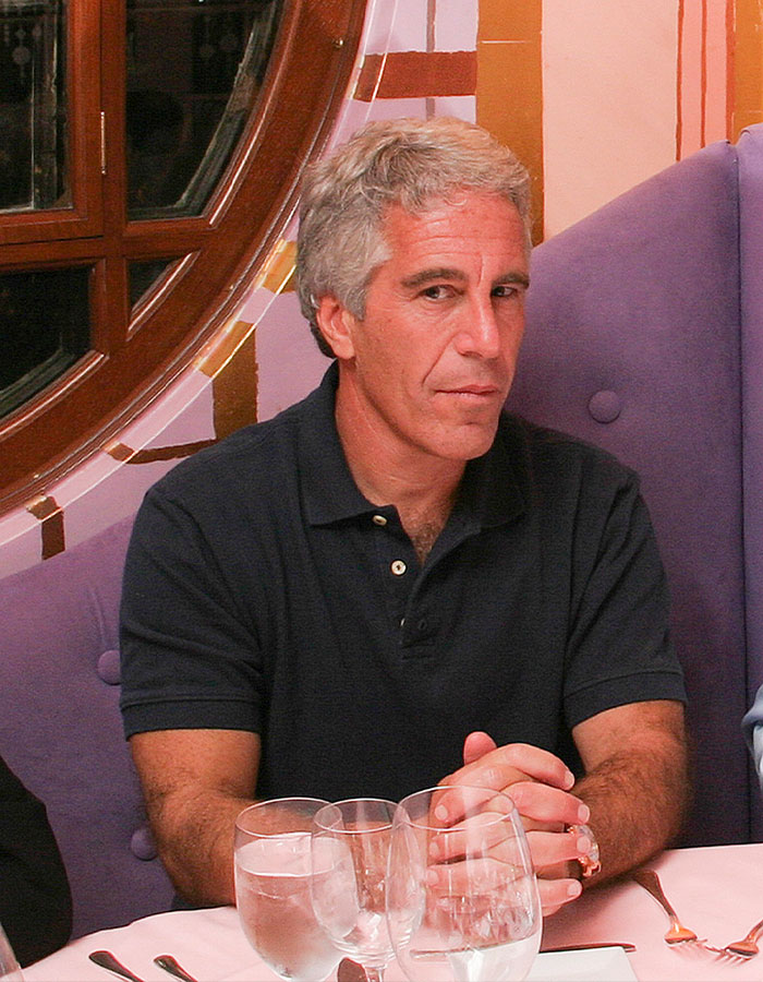Man sitting at a table with glasses, related to conspiracy theories about Epstein list and Stephen King topics. Man sitting at a table with glasses, related to conspiracy theories about Epstein list and Stephen King topics.