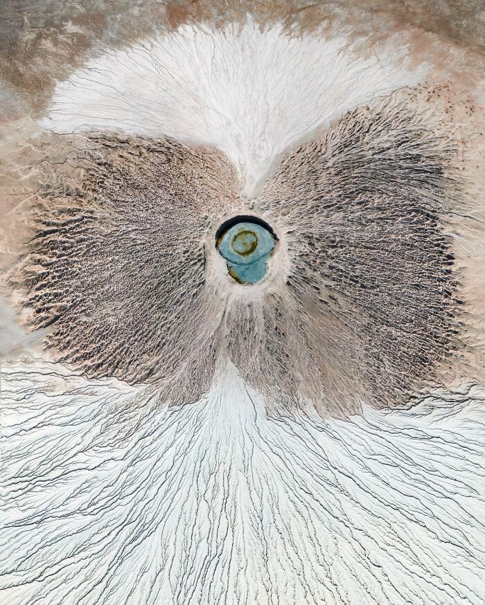 Aerial view of a breathtaking landscape resembling a natural eye with intricate textures and patterns.