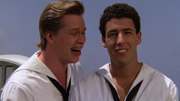 Two men in sailor outfits, one laughing and the other smiling, from one of the worst movies of all time.