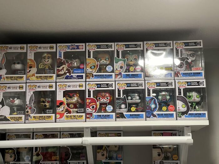 Collection of Funko Pop figures displayed on shelves highlighting trends leading to overconsumption in collectible items.