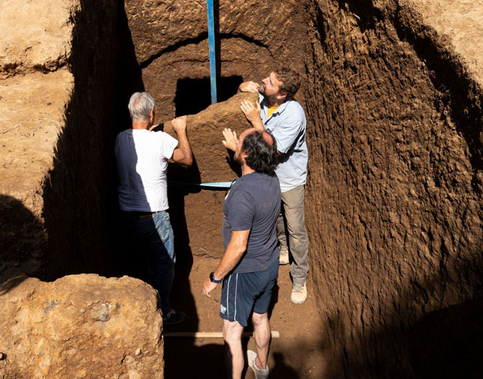 Three archaeologists uncover a 2,600-year-old tomb in Italy, revealing a mysterious burial chamber inside the excavation site. Three archaeologists uncover a 2,600-year-old tomb in Italy, revealing a mysterious burial chamber inside the excavation site.