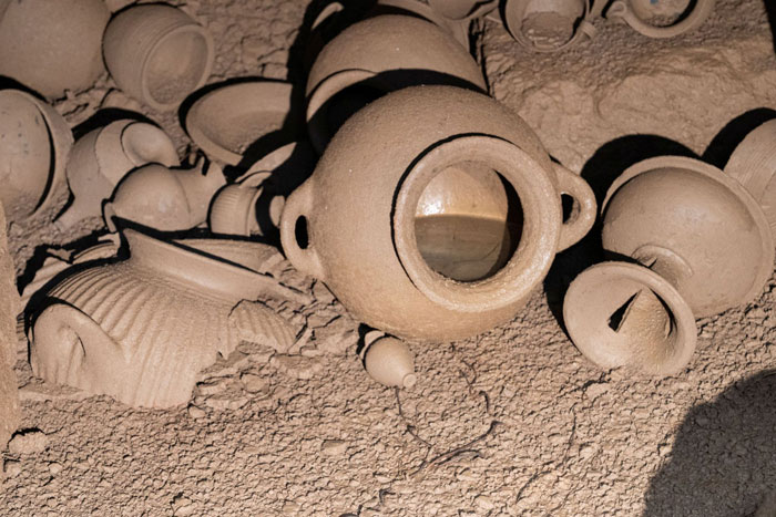 Ancient pottery vessels found inside a 2,600-year-old tomb in Italy during archaeological excavation of burial chamber. Ancient pottery vessels found inside a 2,600-year-old tomb in Italy during archaeological excavation of burial chamber.