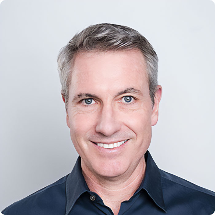 Smiling middle-aged man in a dark shirt representing HR executive linked to Coldplay cheating scandal and Boston's elite families. Smiling middle-aged man in a dark shirt representing HR executive linked to Coldplay cheating scandal and Boston's elite families.