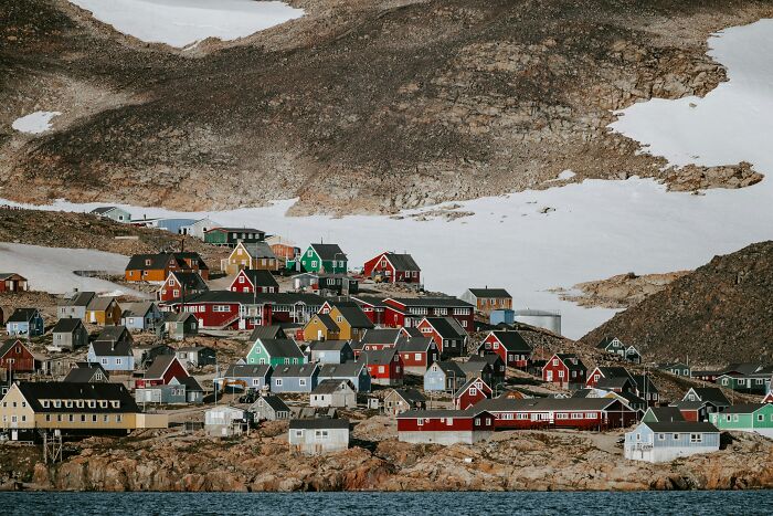 Colorful houses in a remote mountainous area representing one of the smartest countries shaping the future of the world.