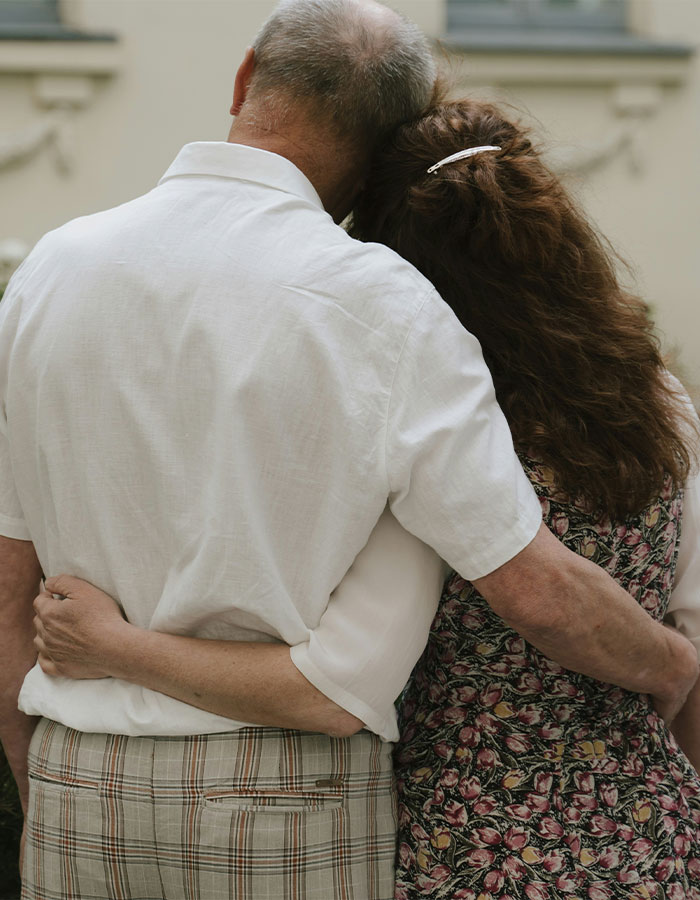 Middle-aged couple hugging outdoors, symbolizing supportive parents in an OnlyFans star's x-rated career journey. Middle-aged couple hugging outdoors, symbolizing supportive parents in an OnlyFans star's x-rated career journey.