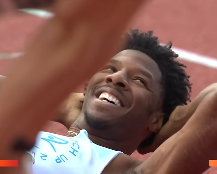 Smiling viral sprinter lying on the track after race, gaining modeling offers following viral shorts incident. Smiling viral sprinter lying on the track after race, gaining modeling offers following viral shorts incident.