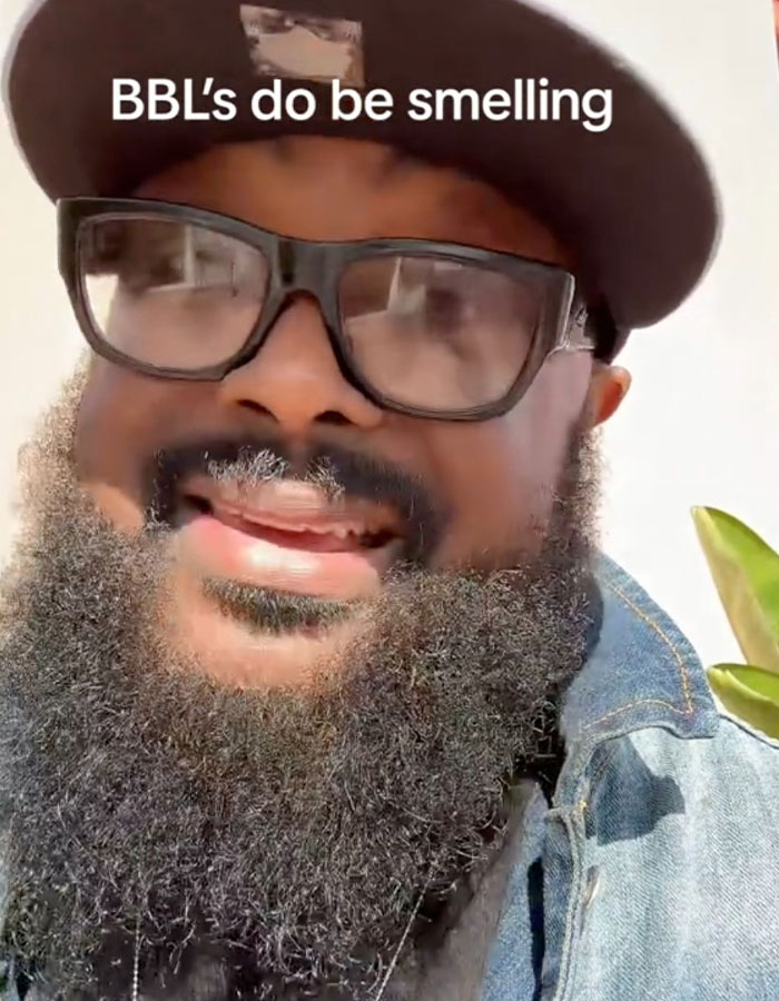 Man with glasses and a thick beard wearing a cap, discussing the BBL smell issue and patient struggles with hygiene. Man with glasses and a thick beard wearing a cap, discussing the BBL smell issue and patient struggles with hygiene.