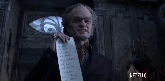 Character from a popular Netflix show holding a long list, emphasizing the best Netflix shows that keep viewers coming back.