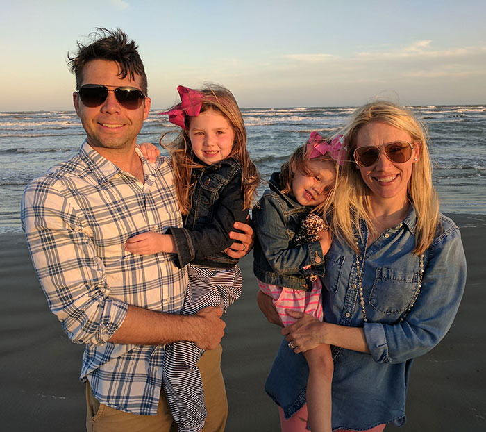 Family with two young daughters at the beach during sunset, representing sisters who lost their lives in Texas floods. Family with two young daughters at the beach during sunset, representing sisters who lost their lives in Texas floods.