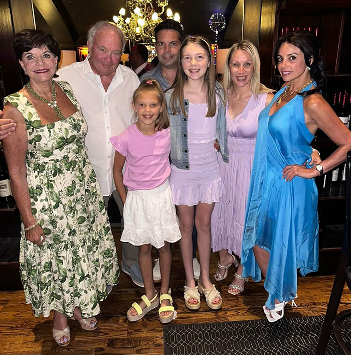 Group of six people posing indoors, representing family moments and Texas floods sisters remembrance. Group of six people posing indoors, representing family moments and Texas floods sisters remembrance.