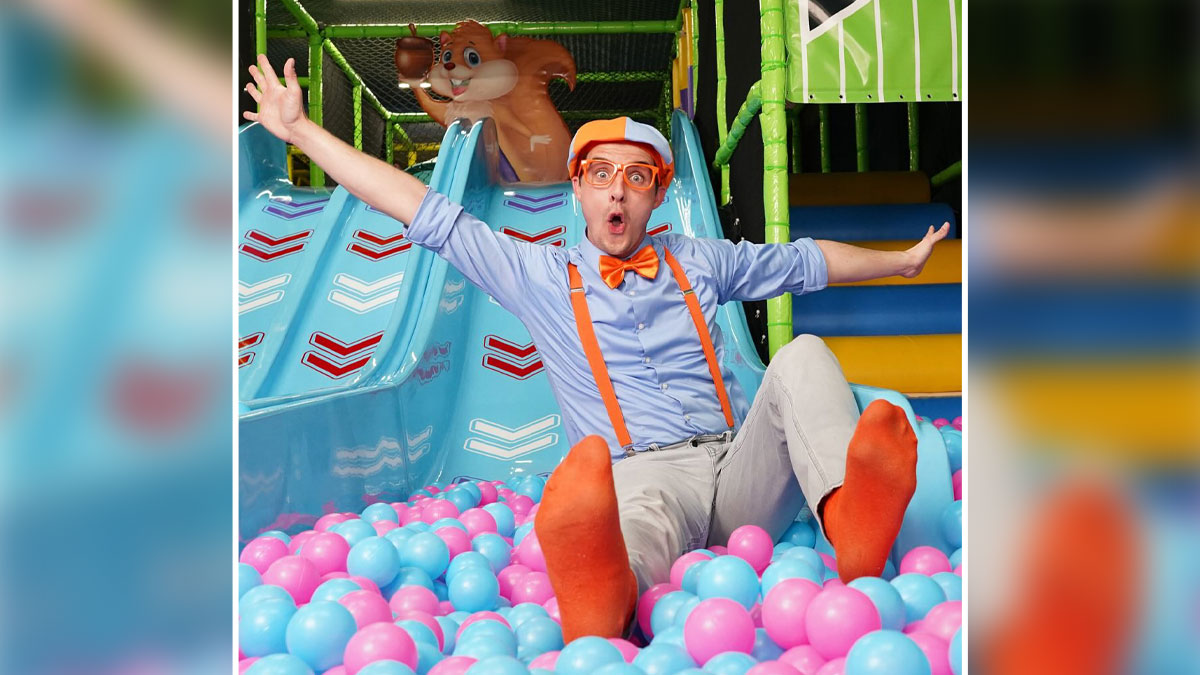 Blippi in colorful outfit playing in ball pit, illustrating kids content growth and Blippi net worth in 2025 trends.