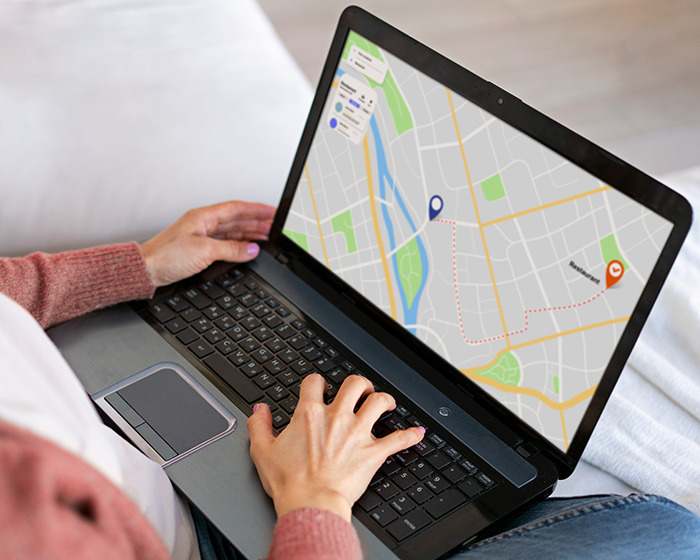 Person using a laptop showing a digital map, illustrating the reason people are blurring their houses on Google Maps. Person using a laptop showing a digital map, illustrating the reason people are blurring their houses on Google Maps.