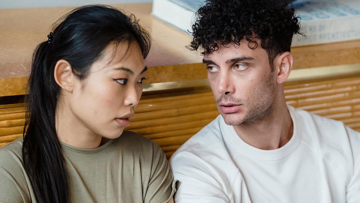 Woman rethinks her relationship showing concern after a red-flag argument with boyfriend in a tense moment.