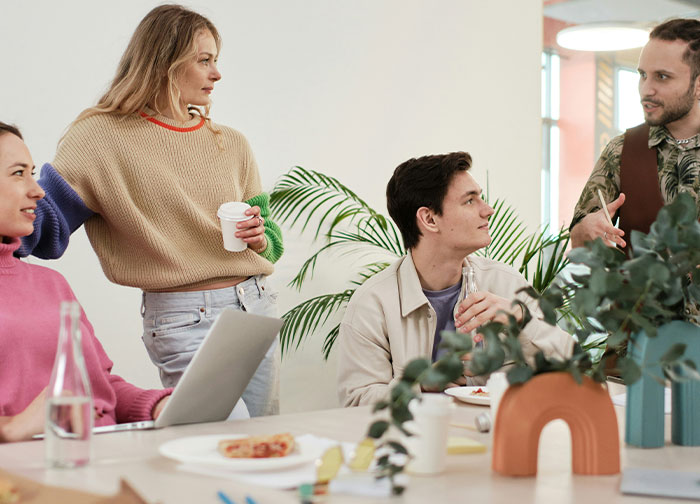 Group of men and women having a serious discussion indoors, highlighting men brutally honest sharing what they never tell women.