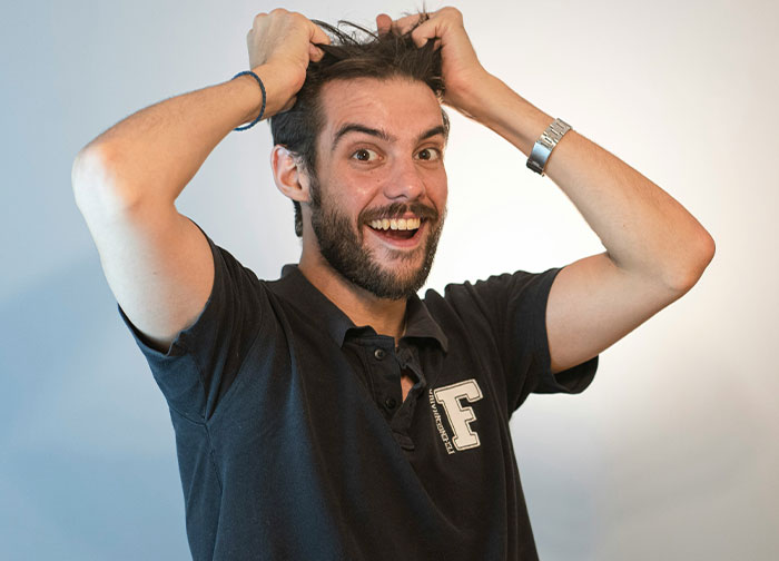 Man with beard and black shirt showing frustration, illustrating men brutally honest about what they never tell women.