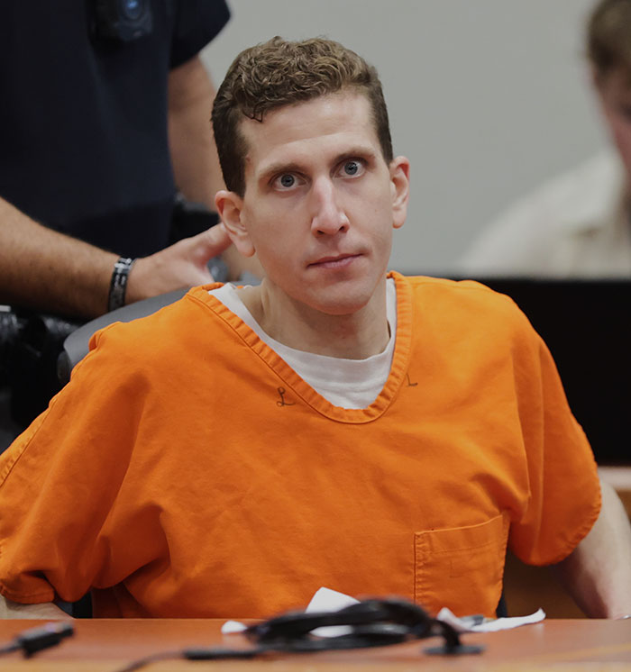 Bryan Kohberger in an orange prison jumpsuit, sitting in a courtroom during legal proceedings. Bryan Kohberger in an orange prison jumpsuit, sitting in a courtroom during legal proceedings.