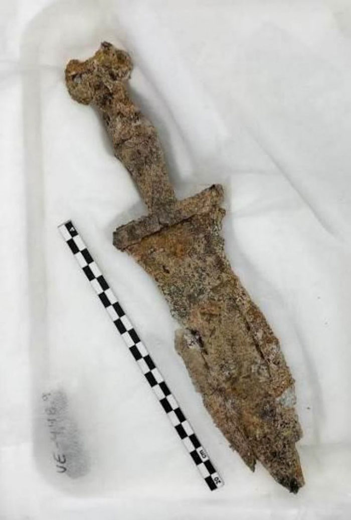 Ancient rusted dagger uncovered during excavation at site planned for solar farm construction. Ancient rusted dagger uncovered during excavation at site planned for solar farm construction.