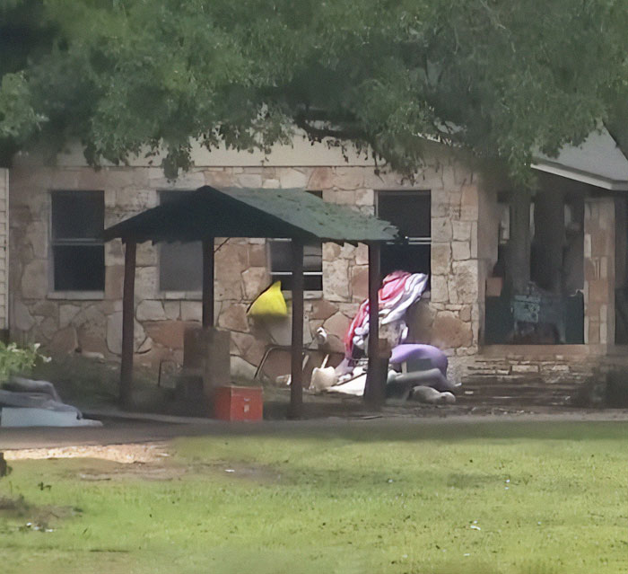 Stone building with scattered belongings outside, highlighting flood-stricken Camp Mystic controversy and official sparks outrage. Stone building with scattered belongings outside, highlighting flood-stricken Camp Mystic controversy and official sparks outrage.