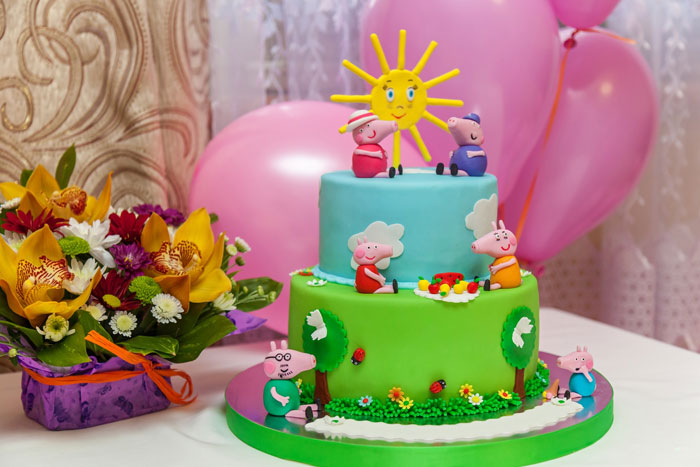 Colorful kids party cake with cartoon characters and decorations, related to sister and aunt party drama over cake payment. Colorful kids party cake with cartoon characters and decorations, related to sister and aunt party drama over cake payment.