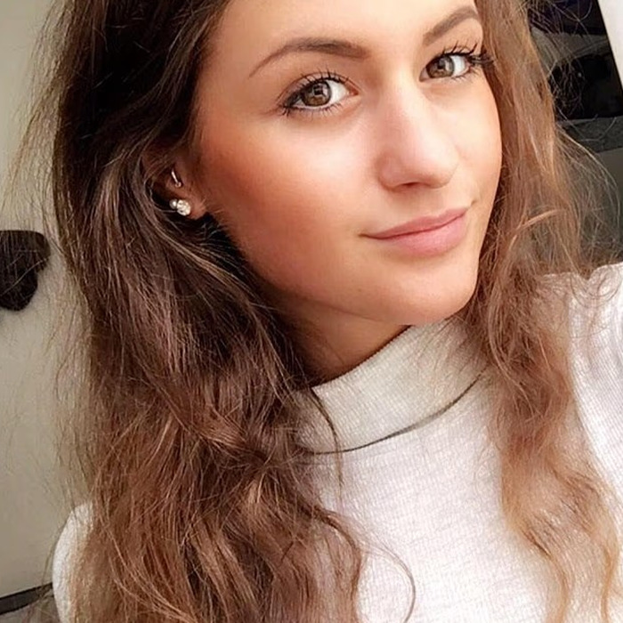 Young woman with long hair wearing a white top, representing the backpacker found after going missing in Australian outback. Young woman with long hair wearing a white top, representing the backpacker found after going missing in Australian outback.