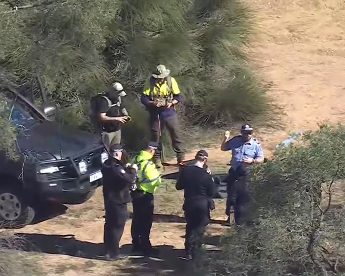 Rescue team with police officers at Australian Outback site where backpacker who went missing was found. Rescue team with police officers at Australian Outback site where backpacker who went missing was found.