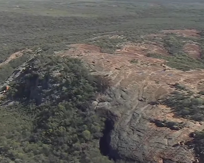Aerial view of Australian outback terrain where backpacker who went missing after unexplained behaviour was found. Aerial view of Australian outback terrain where backpacker who went missing after unexplained behaviour was found.