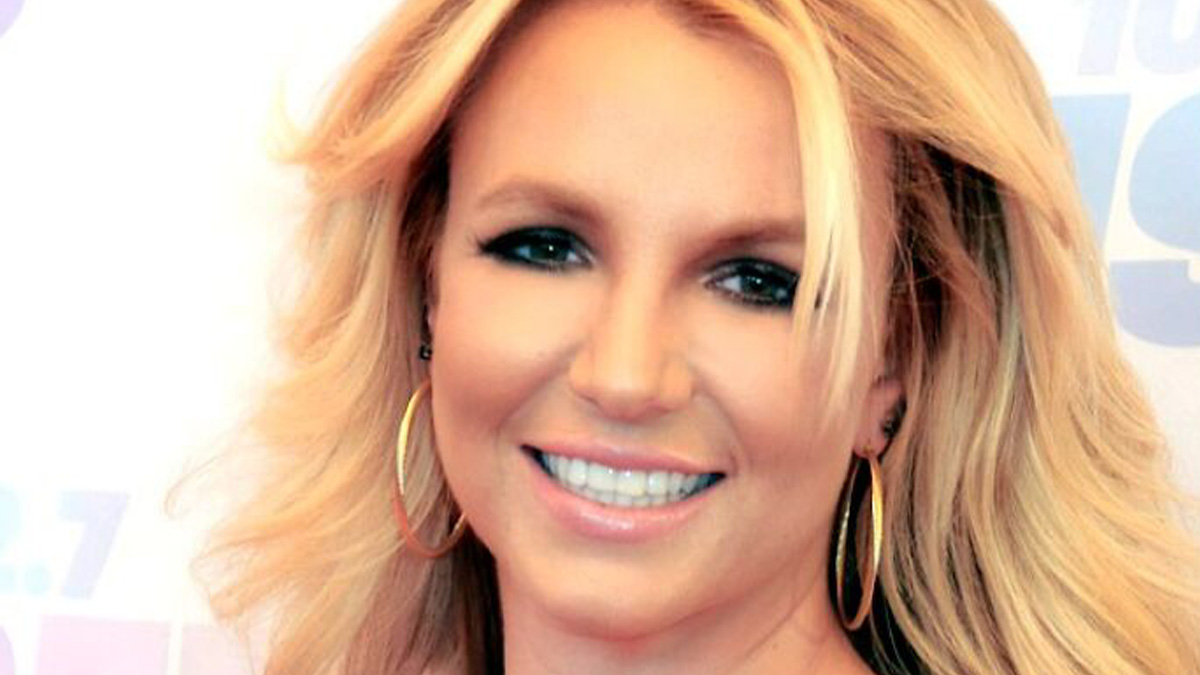 Blonde female celebrity smiling with hoop earrings in a close-up portrait for misunderstood celebrities topic